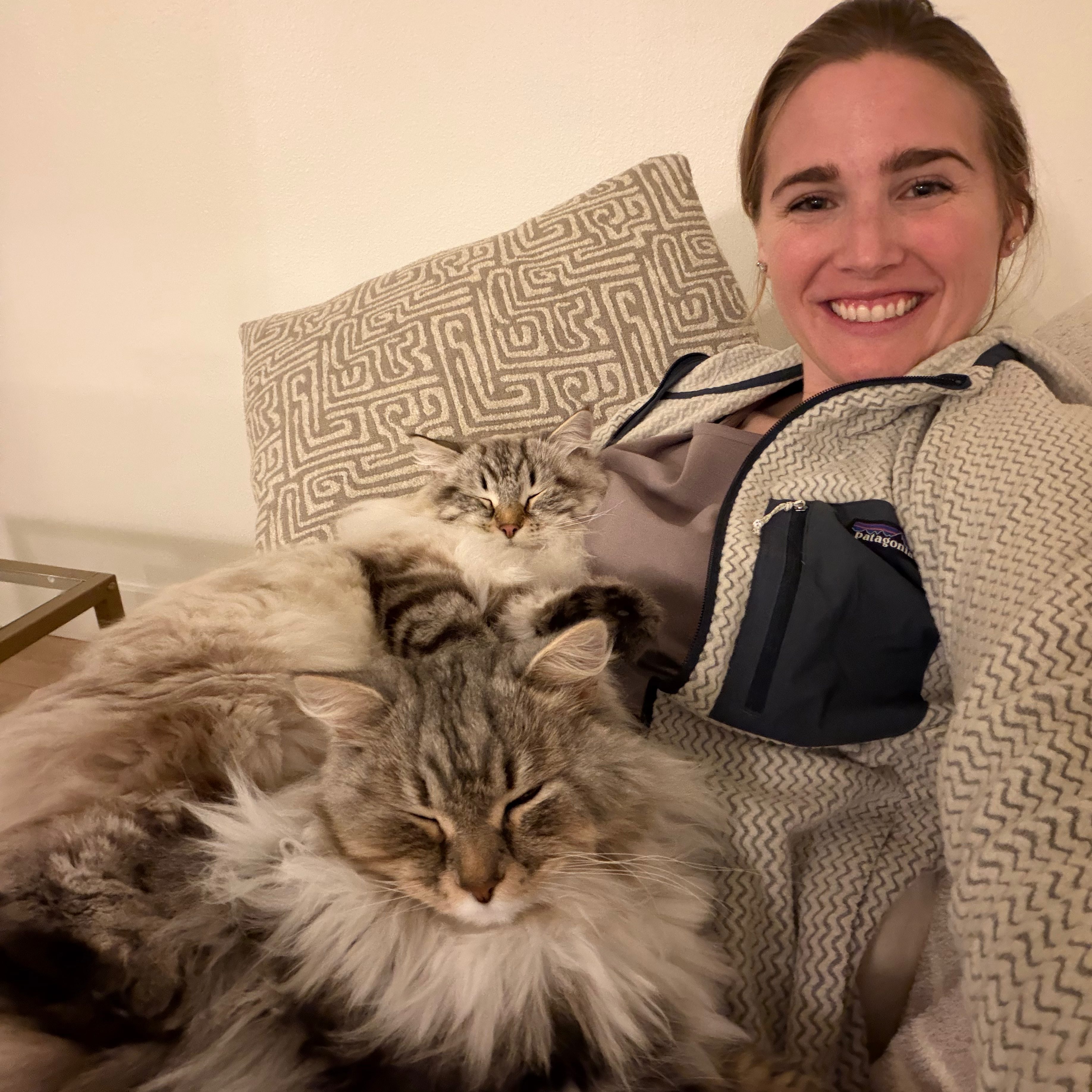 Aleigha with her two cats snuggling